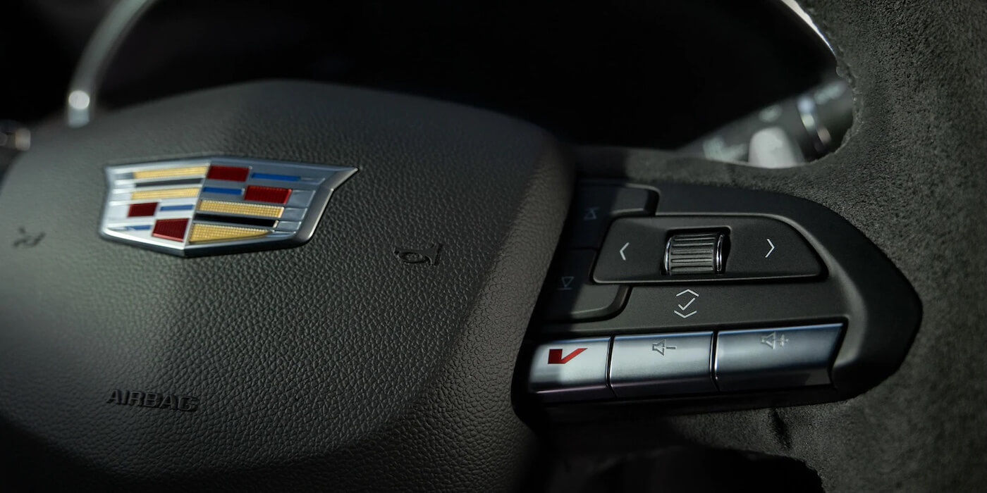 The 2021 Cadillac CT5 steering wheel including volume controls and cruise control