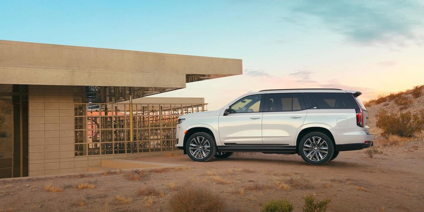 The white 2021 Cadillac Escalade ESV SUV parked in a desert