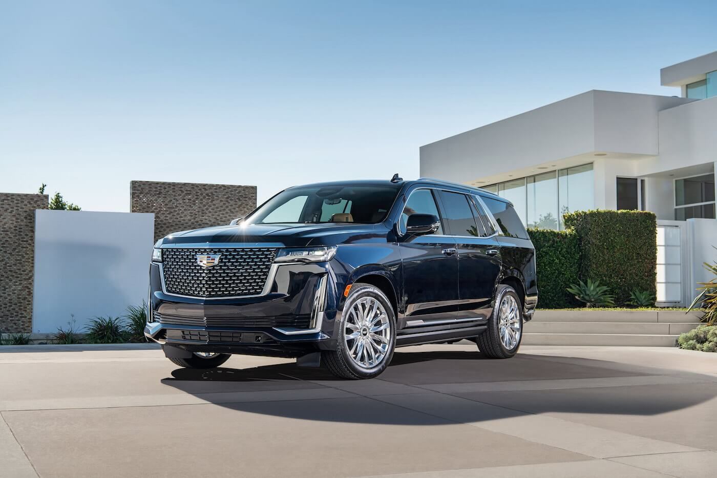 The 2021 Cadillac Escalade luxury SUV parked in the backyard of a house