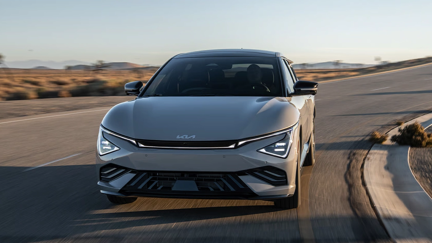 Front view of the Kia EV6 on the road at full power