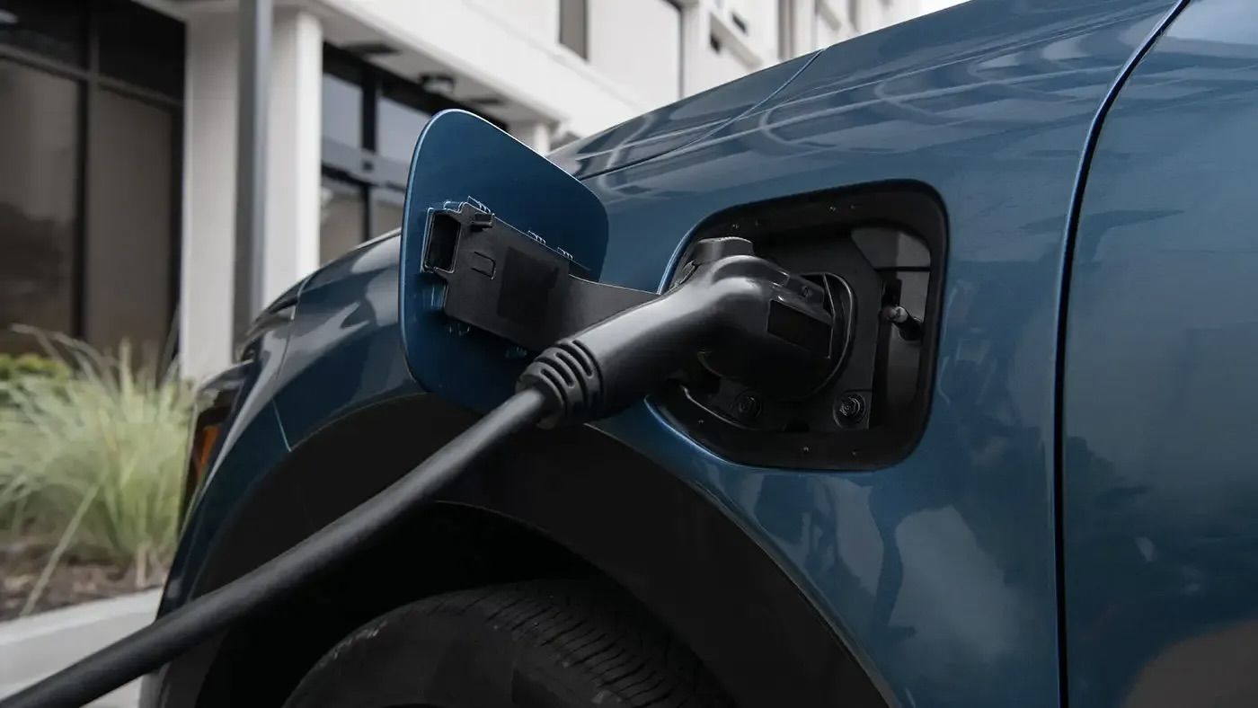 The Kia Niro being charged in the city.