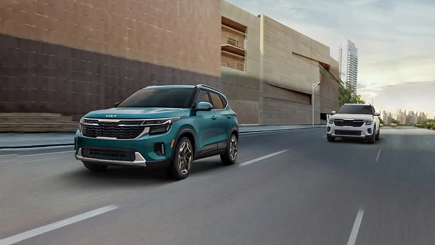 View of two 2026 Kia Seltos on the road