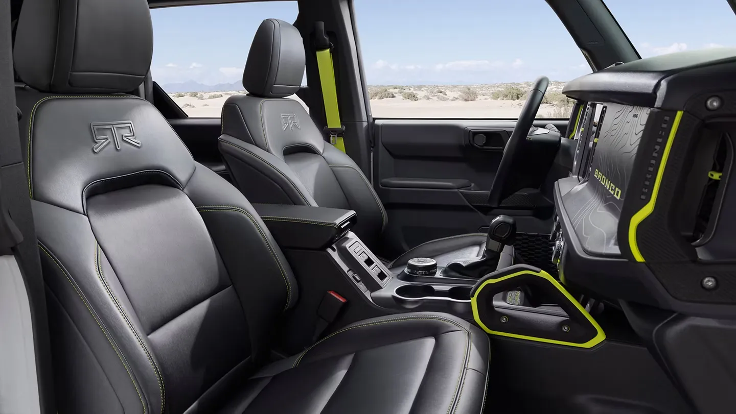 Ford Bronco cabin with black seats and removable roof.