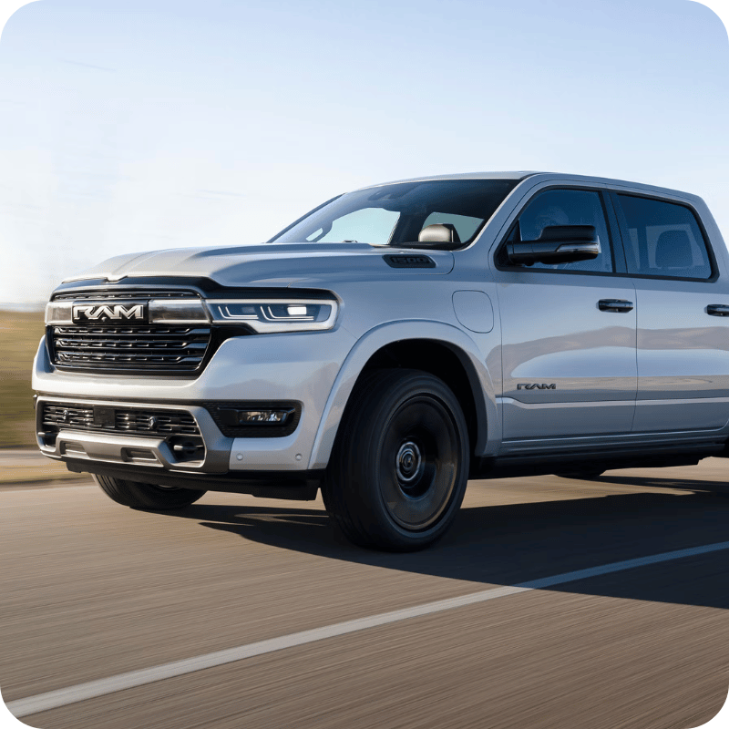 White Ram 1500 REV on the highway.