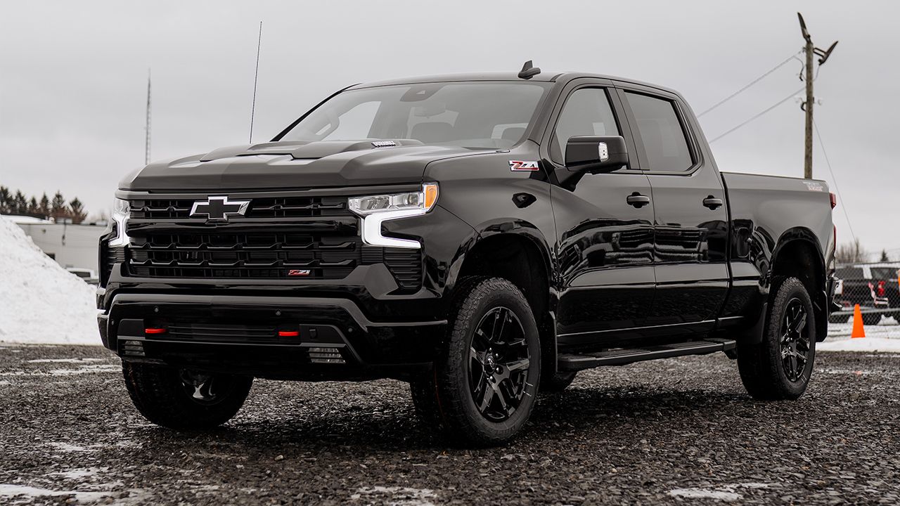 Three-quarter front and side view of the black Silverado 1500, ready for commercial use