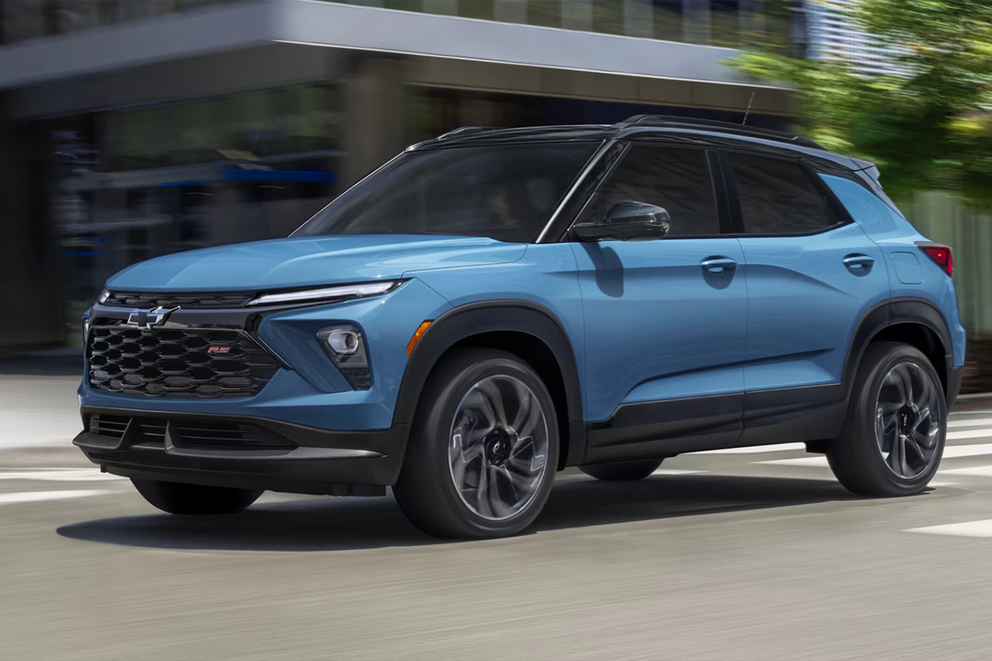 Three-quarter front and side view of the 2026 Chevrolet Trailblazer on the road at full throttle