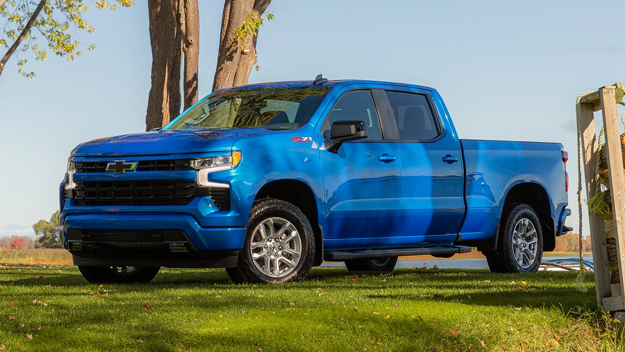 Three-quarter front and side view of a blue 2026 Chevrolet Silverado 1500 parked on a lot