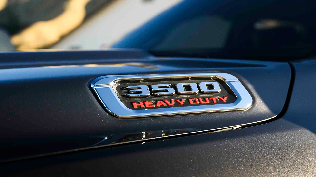A close-up of the chrome “3500 Heavy Duty” badge on the body of a Ram 3500 HD truck.