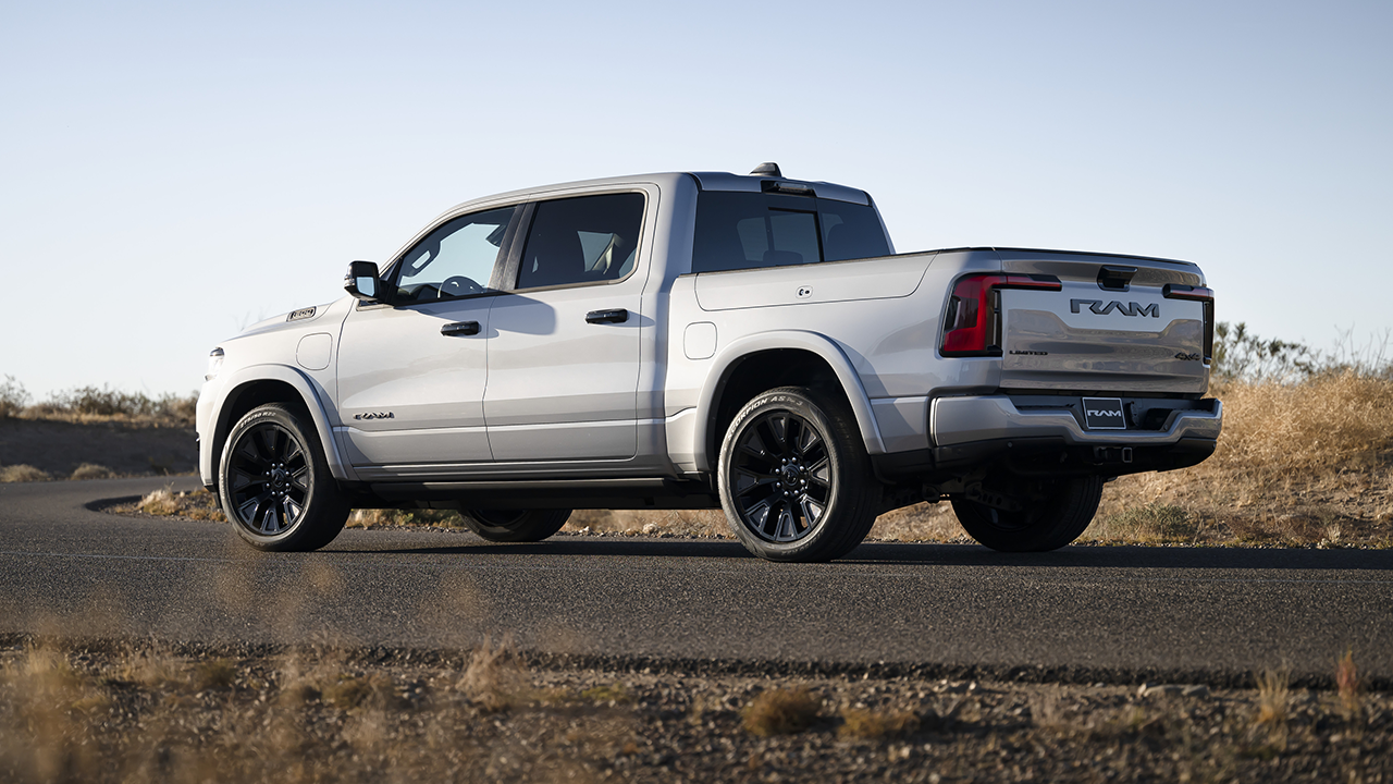 3/4 side and rear view of the Ram Rev 2026 parked on the side of the road