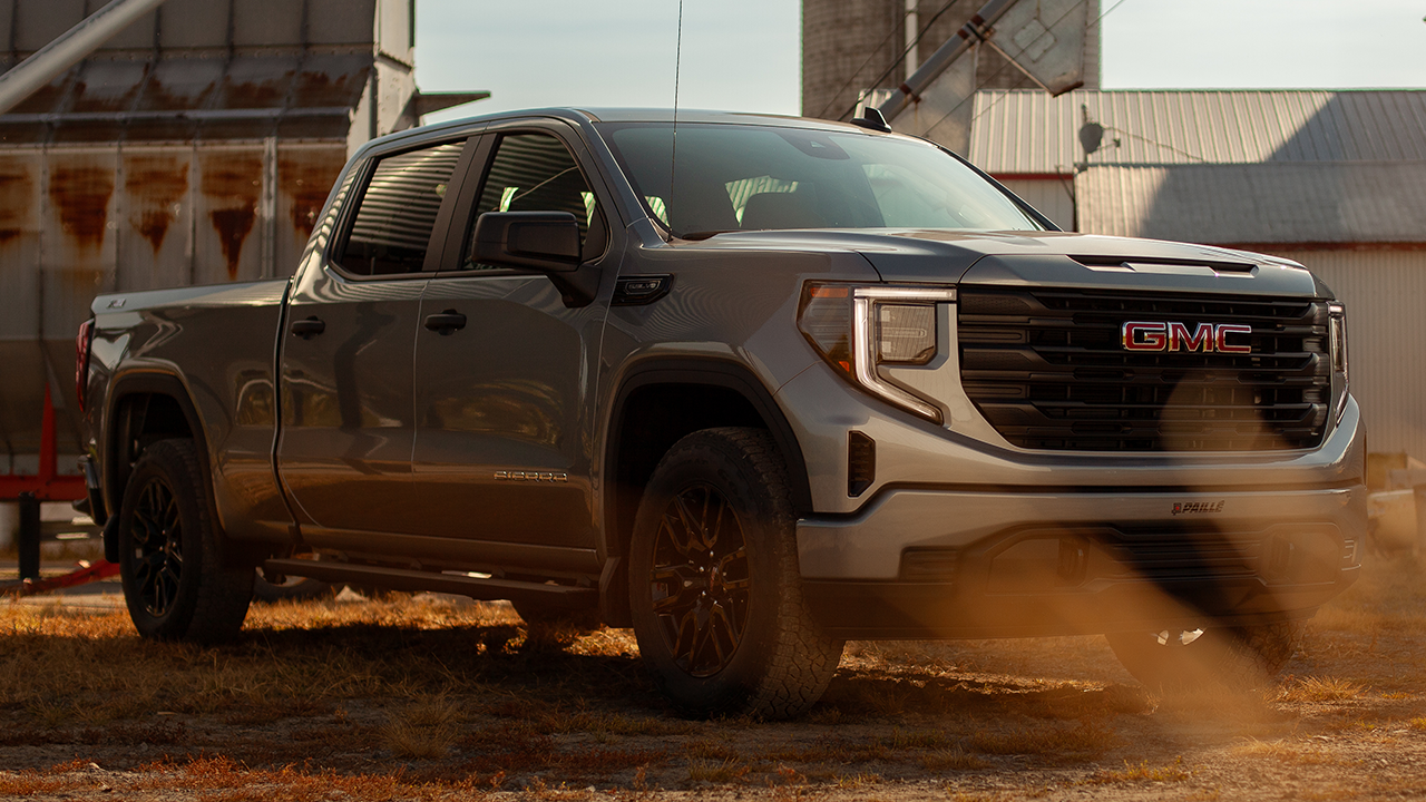 3/4 front and side view of the 2027 GMC Sierra 1500 on a farm
