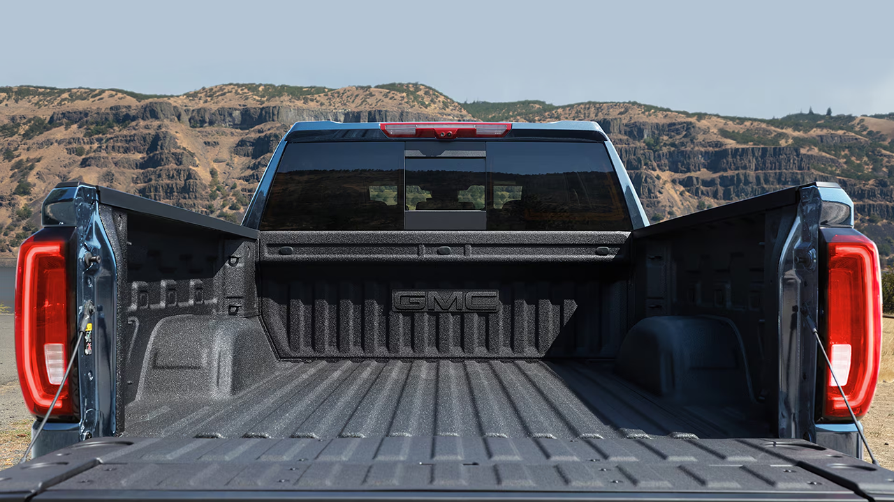 Rear view of the GMC AT4 and its open bed