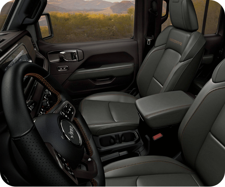 A view of the interior of the 2026 RAM 1500, showing its dashboard and comfortable seats