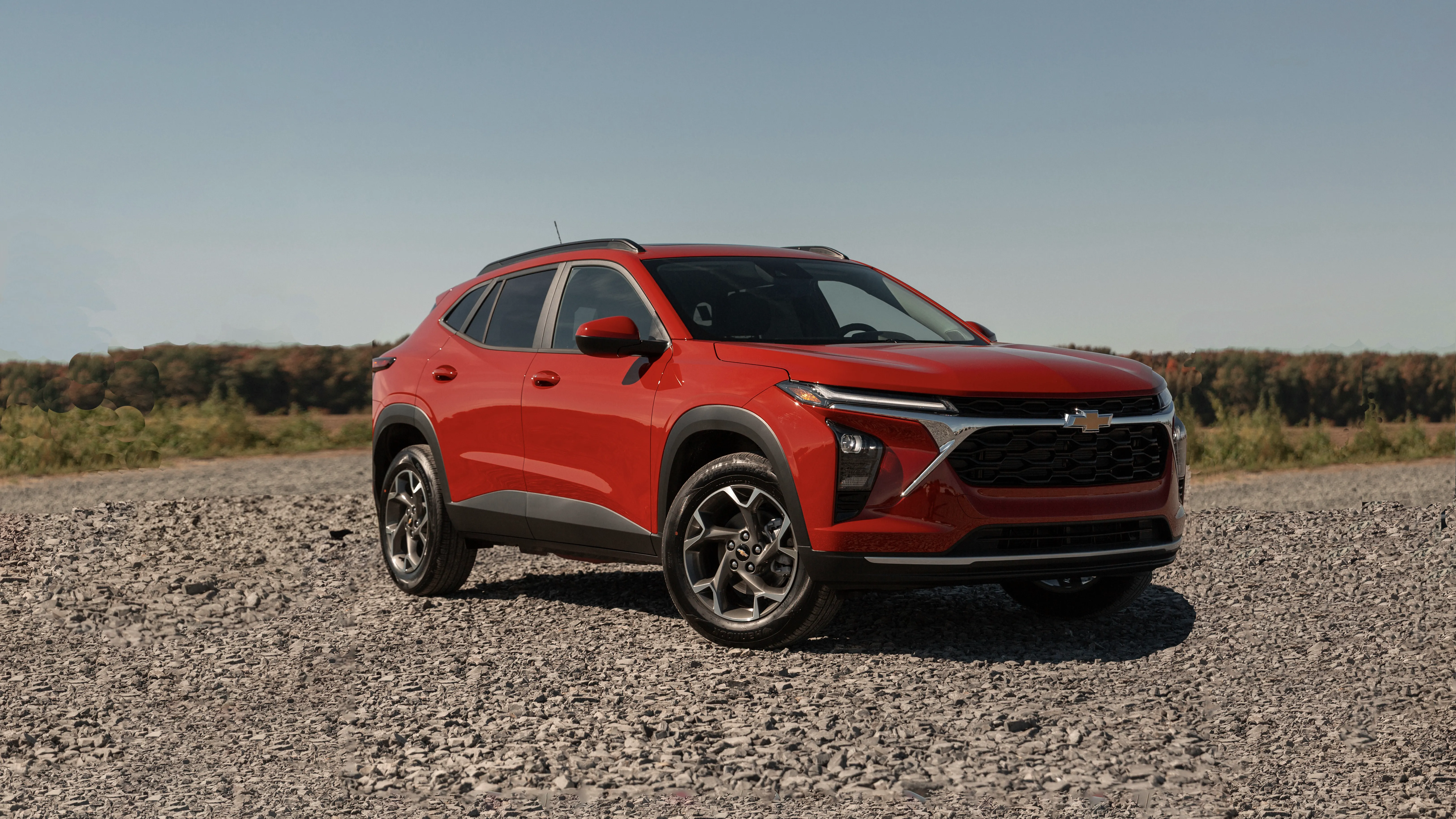 The Chevrolet Trax parked on a gravel road in the countryside.