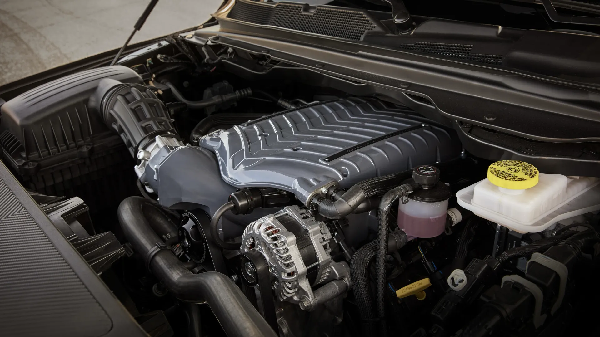 V8 engine of a RAM 1500 seen under the open hood.