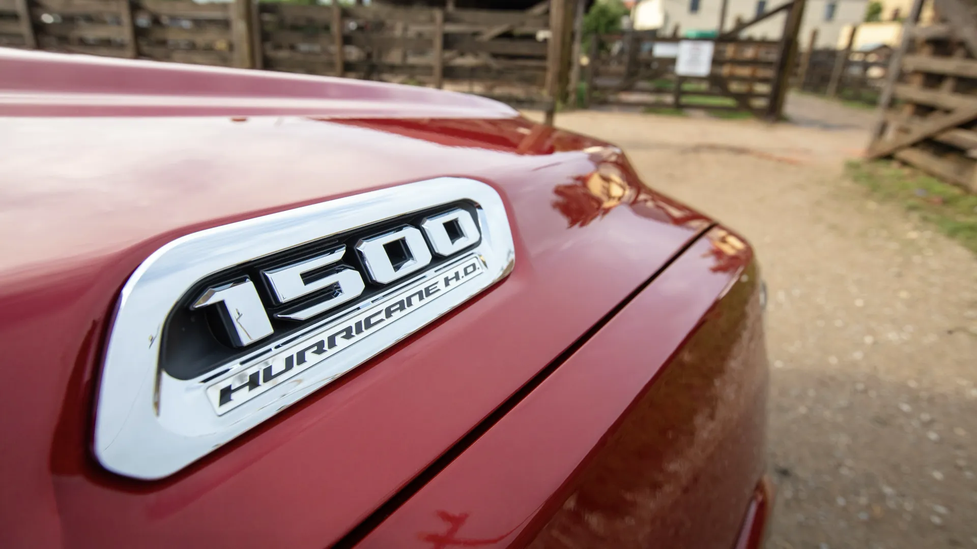 “1500 Hurricane” badge on the fender of a red RAM 1500.