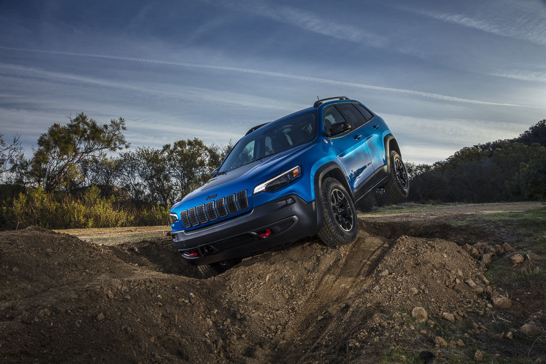 The 2022 Jeep Cherokee Trailhawk model in action on off-road terrain