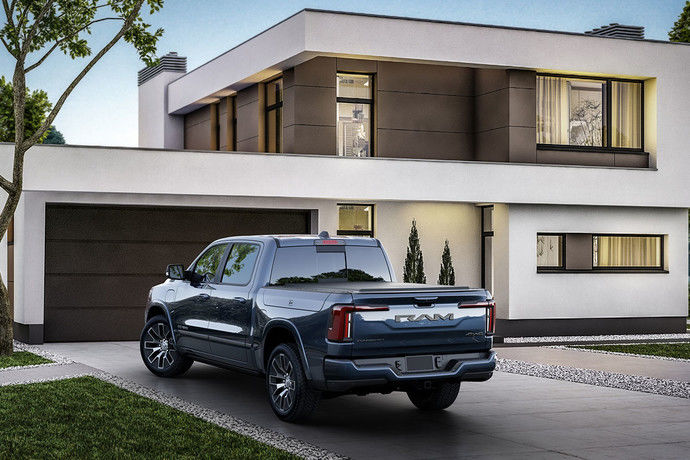 RAMCHARGER parked in a driveway in front of a residence