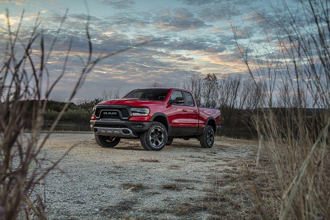 3/4 front view of a RAM 1500 Rebel parked outside.