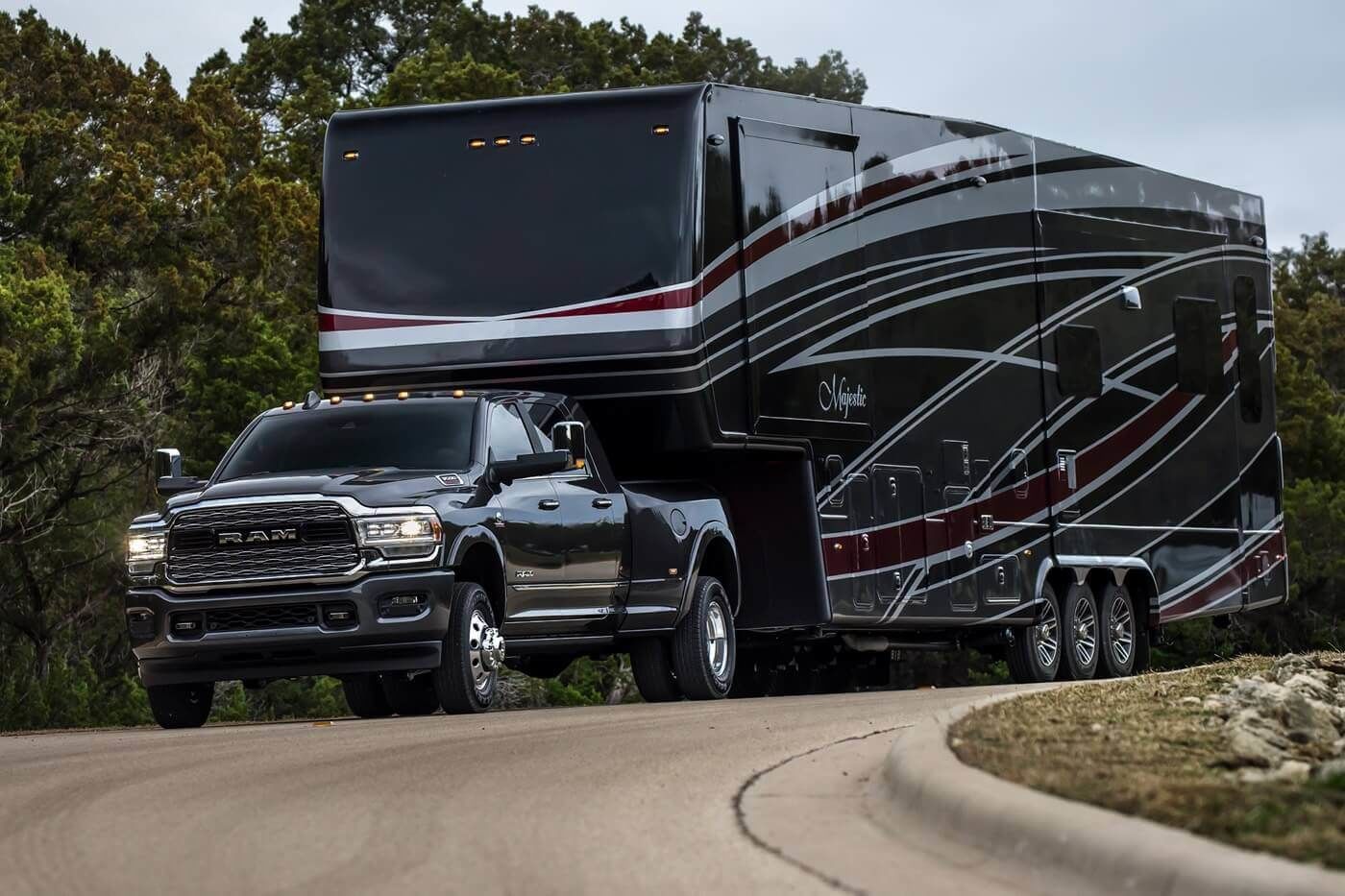 A RAM 3500 truck towing a large trailer.