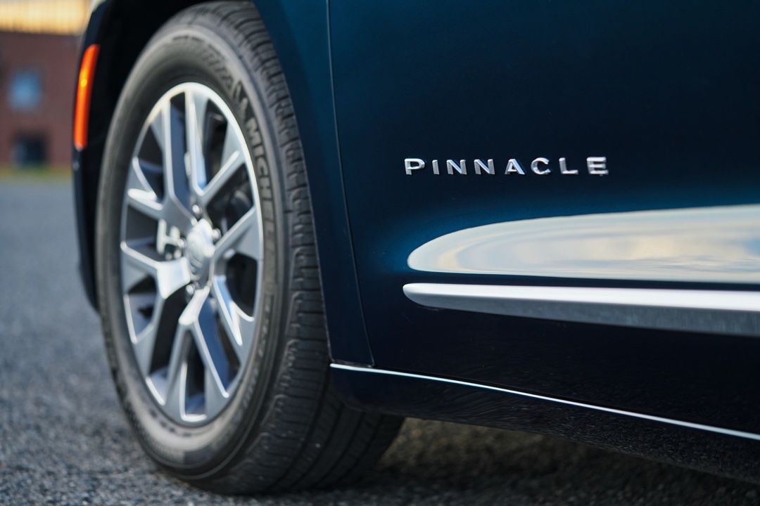 Pinnacle emblem printed on the side of the 2025 Chrysler Pacifica Hybrid.