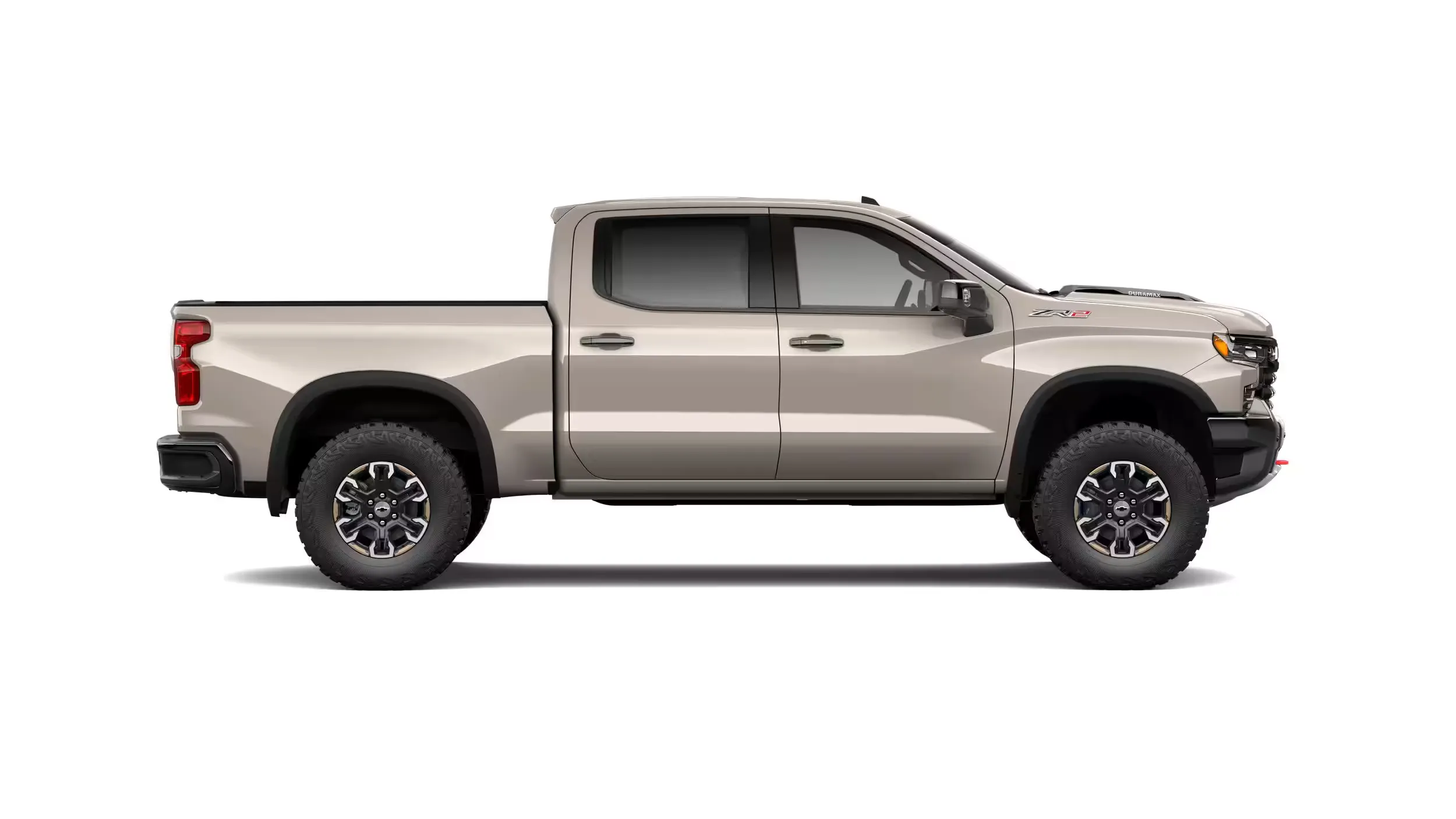 Beige Chevrolet Silverado 1500 ZR2 in profile, trim specialized for off-road driving