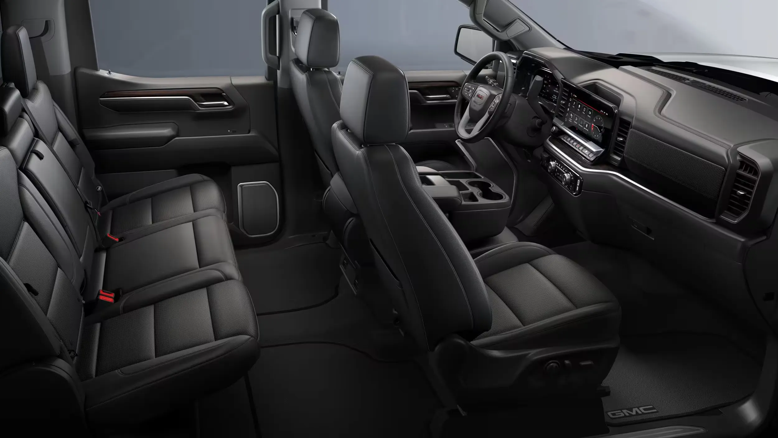 Habitacle du GMC Sierra 1500 SLT 2026 avec si&egrave;ges et cabine double rang&eacute;e.