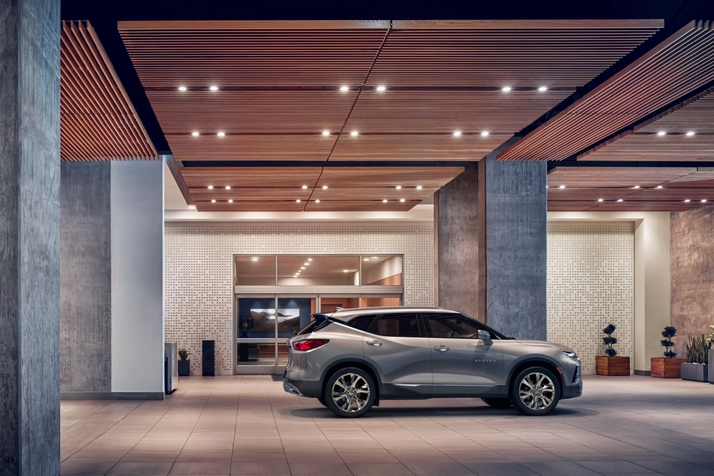 Chevrolet Blazer parked in front of a modern building, closing image for the used buying guide.