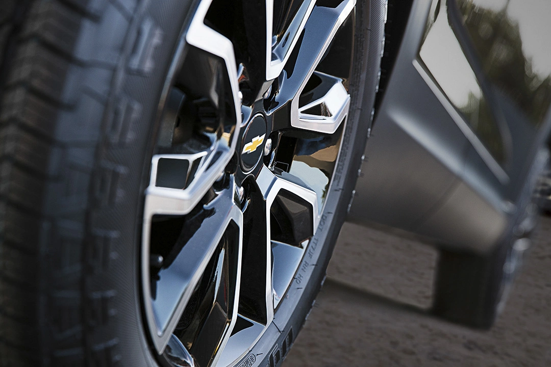 Close-up of a Chevrolet wheel, representing mechanical inspection before buying used.