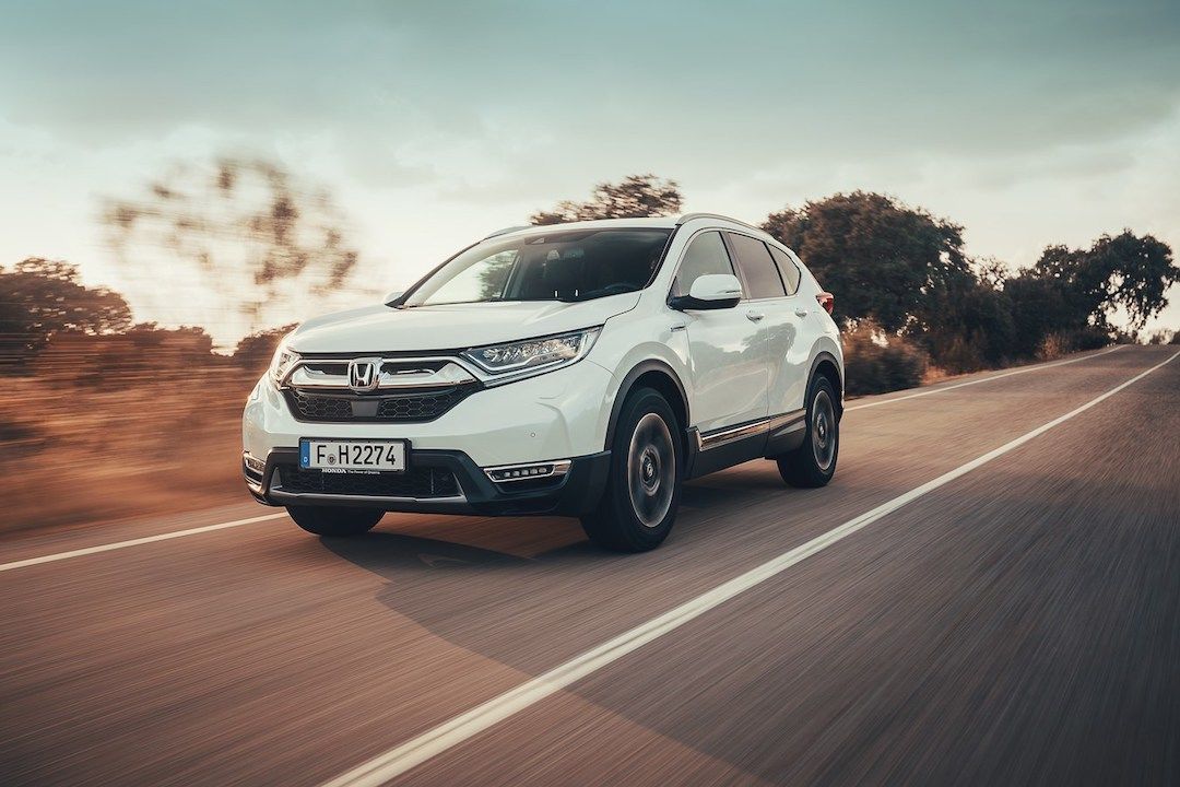 front 3/4 view of the 2019 Honda CR-V Hybrid driving on a road