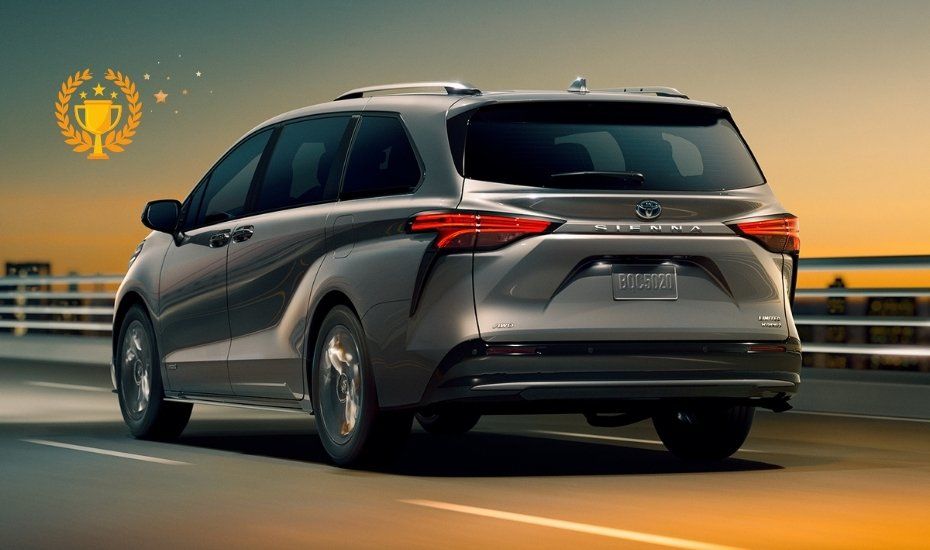 Rear 3/4 view of the 2021 Toyota Sienna Limited on the road and winner of the duel