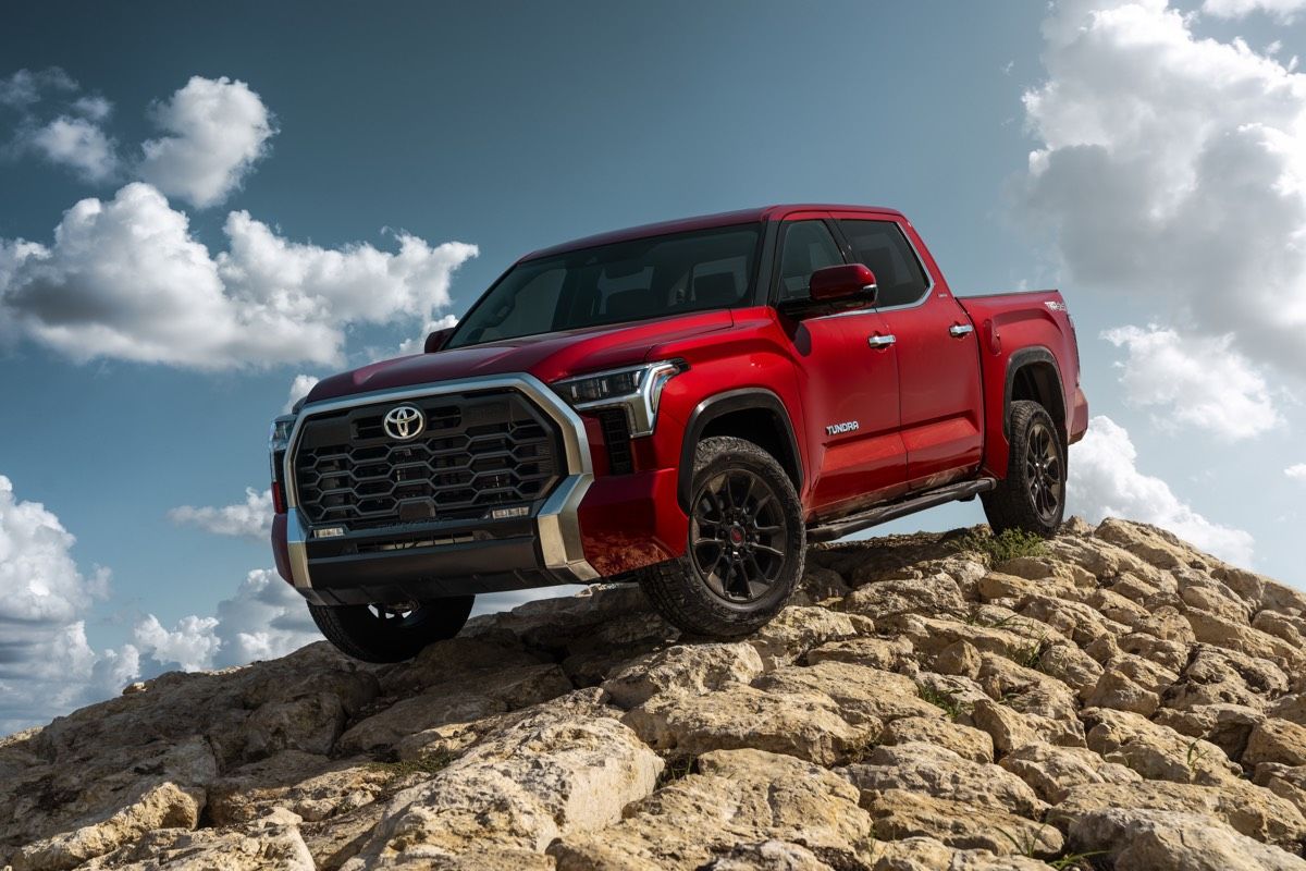 The 2022 Toyota Tundra Limited pointing its nose to the ground parked on a mound of rocks