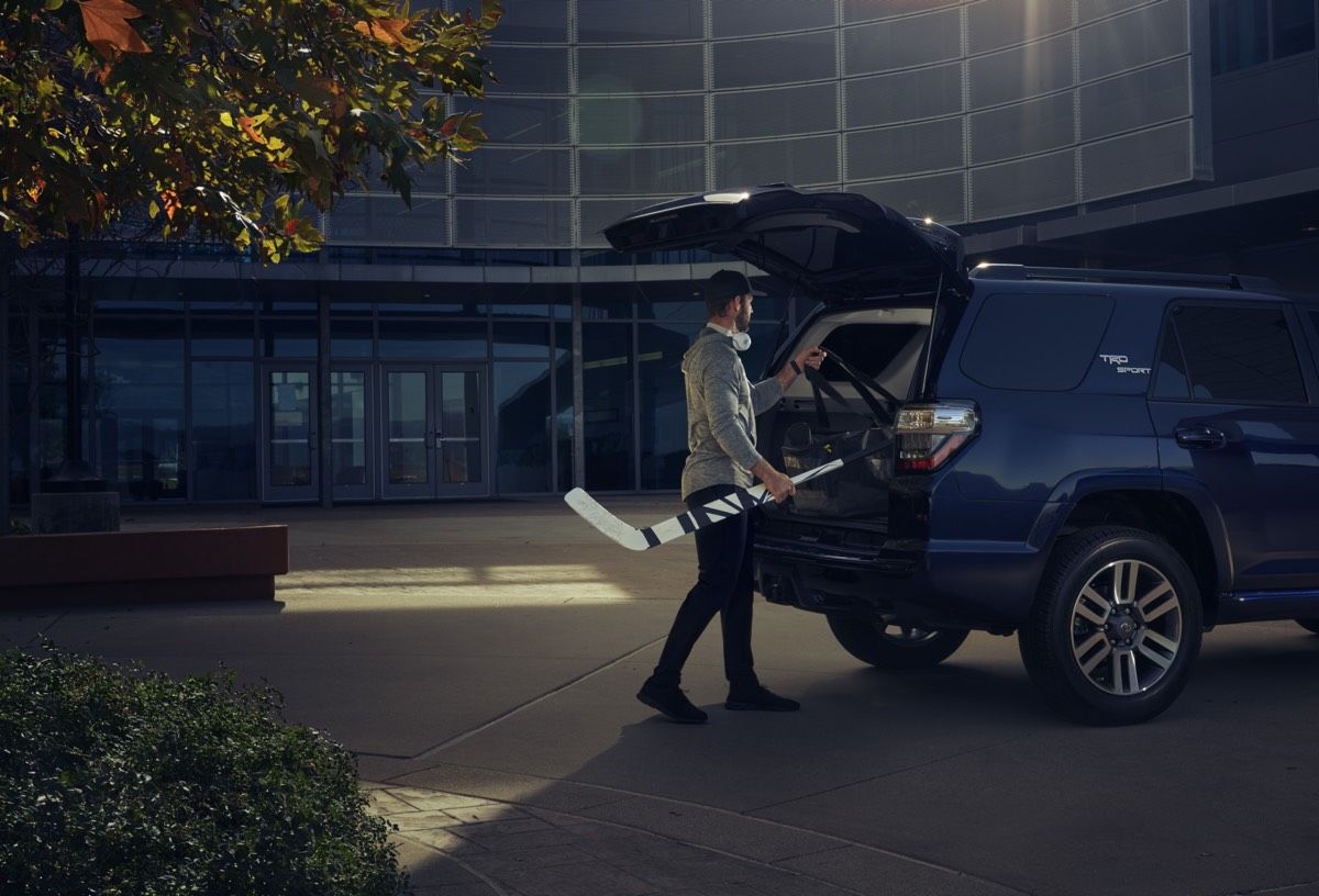 Driver loading his goalie gear into the trunk of his 2022 Toyota 4Runner TRD Sport