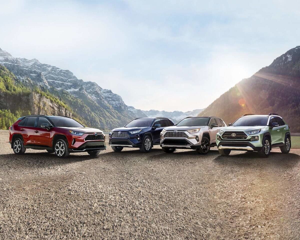 Four 2021 Toyota RAV4 SUVs models parked in the mountains