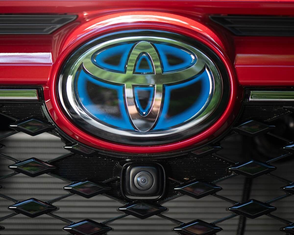 The blind spot monitor camera below the Toyota logo of the 2021 RAV4