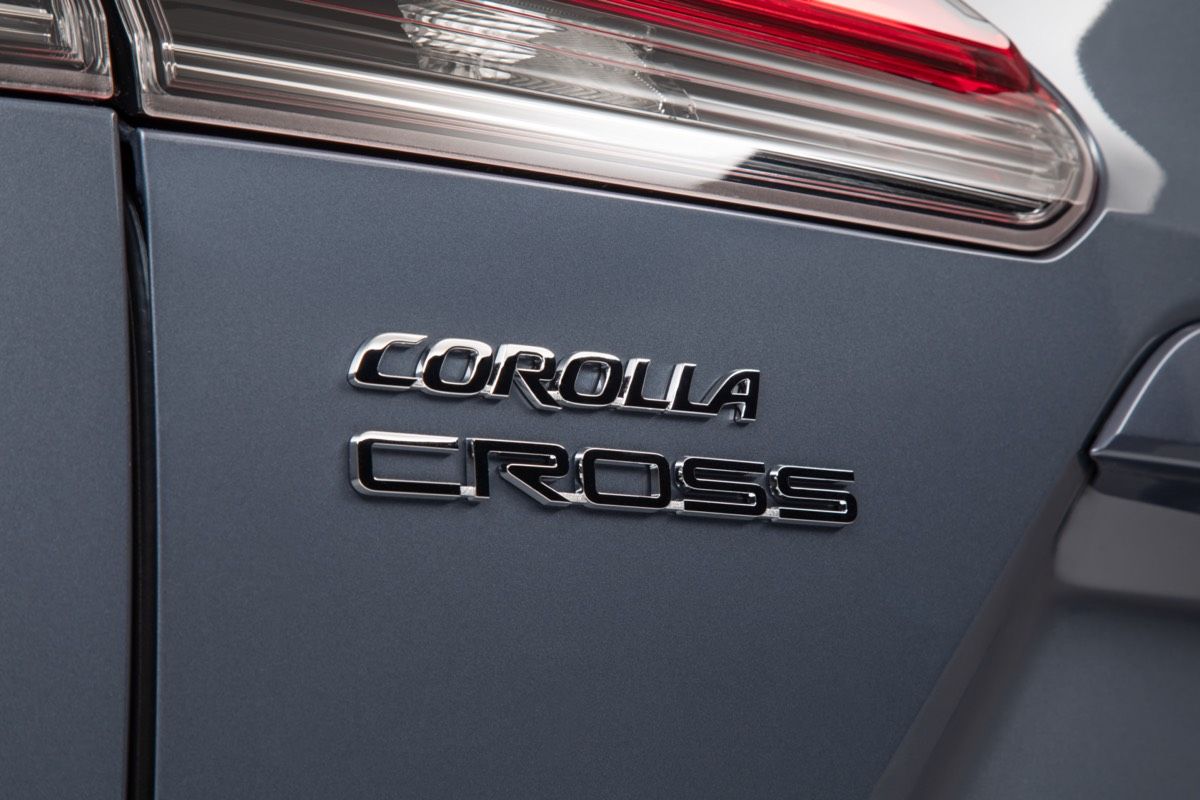 The letters COROLLA CROSS printed on the trunk of a 2022 Toyota Celestine SUV