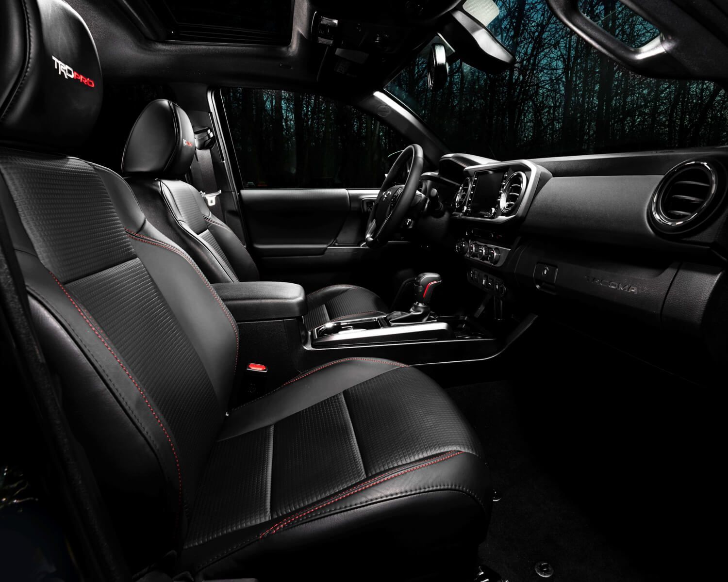 The black leather front interior of a 2022 Toyota Tacoma TRD Pro