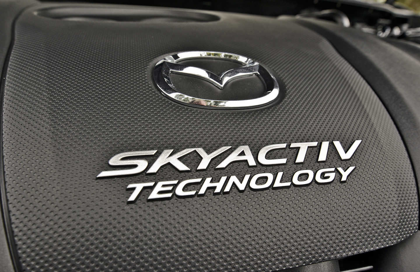 How does SKYACTIV technology improve fuel economy?