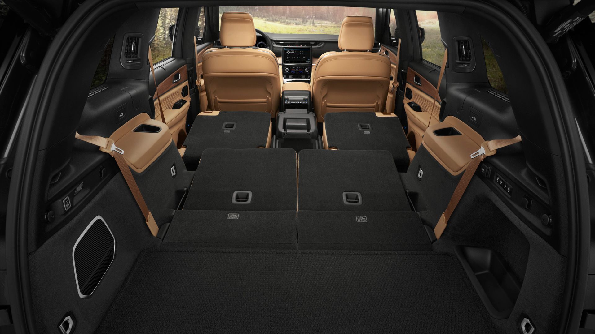 2026 Jeep Grand Cherokee L - Interior view of the cargo space in a Jeep Grand Cherokee L with the rear seats folded down - Cooksville Dodge Chrysler - New car dealership in Mississauga, Ontario
