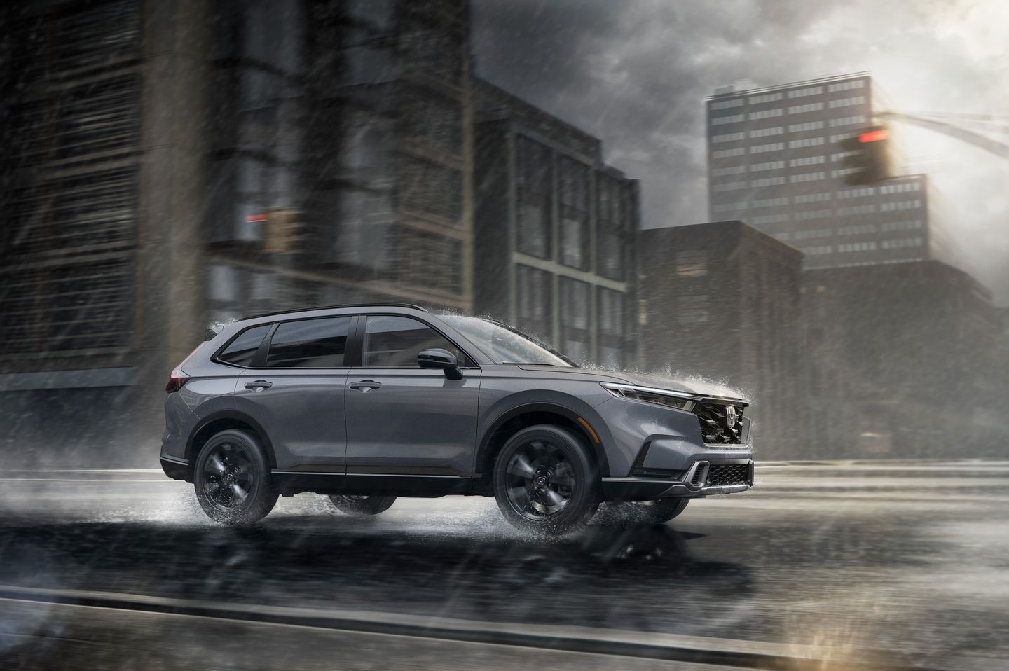 2026 Honda CR-V - a grey 2026 Honda CR-V driving on a wet city street in the rain - AutoPark Barrie - Accessible car dealership in Barrie, Ontario
