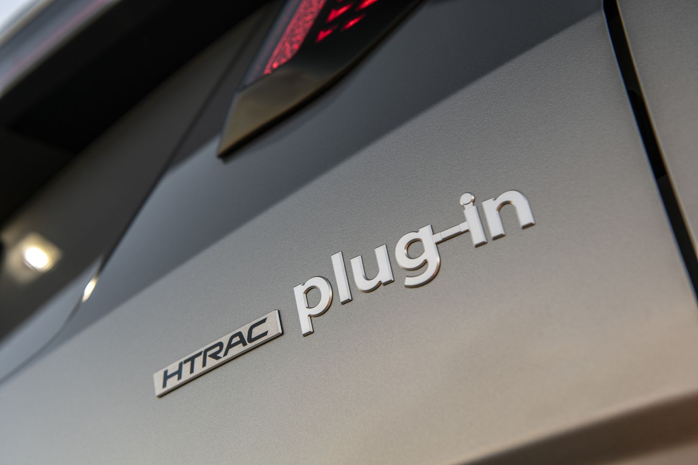 2026 Hyundai Tucson - close-up of the plug-in and HTRAC badging on the rear of a 2026 Hyundai Tucson - Cooksville Hyundai - Hyundai new car dealership in Mississauga, Ontario