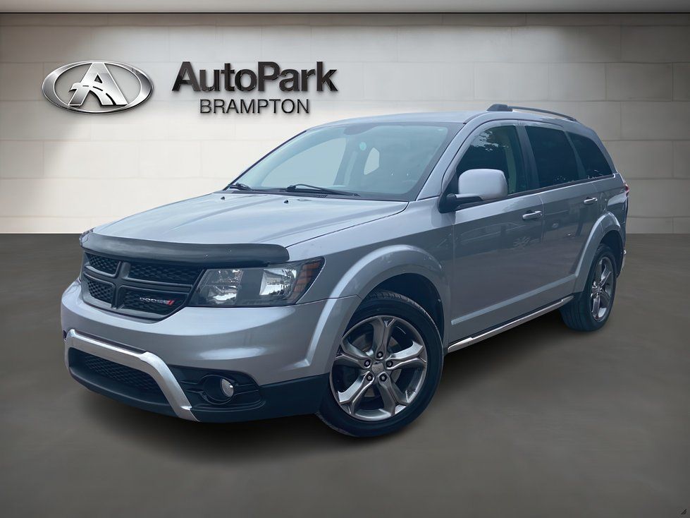 2017 Dodge Journey - a silver 2017 Dodge Journey parked in front of a dealership wall - AutoPark Brampton - Used car dealership in Brampton, Ontario