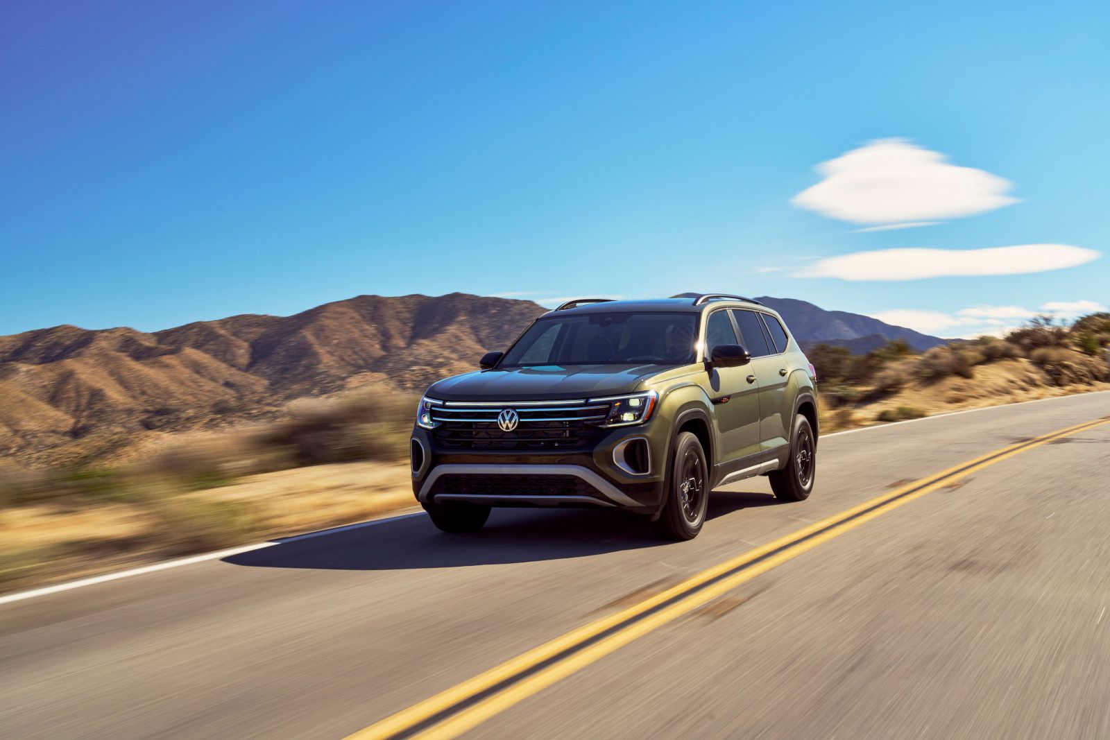2026 Volkswagen Atlas - front three-quarter view of a green 2026 Volkswagen Atlas driving on a desert highway - Humberview Volkswagen - New car dealership in Toronto, Ontario