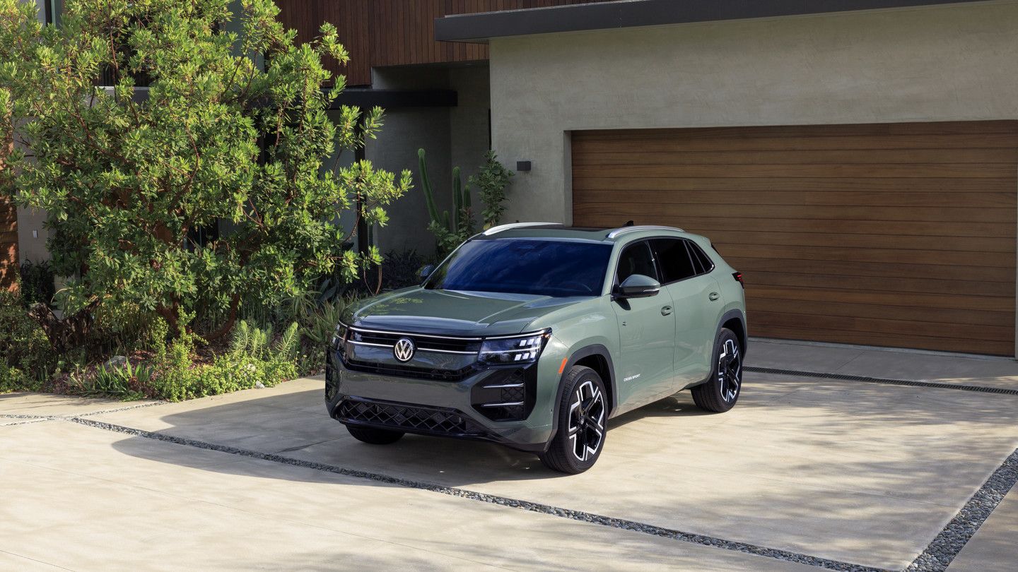 2027 Volkswagen Atlas Cross Sport - front three-quarter view of a sage green 2027 Volkswagen Atlas Cross Sport parked in a driveway - Volkswagen Midtown Toronto - Volkswagen car dealership in Toronto, Ontario