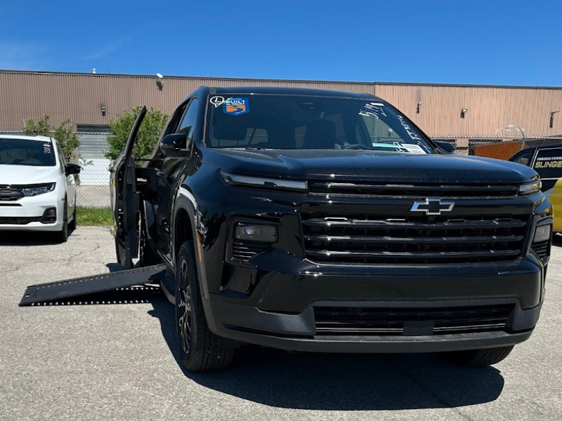 2026 Chevrolet Traverse - a black 2026 Chevrolet Traverse with an extended wheelchair ramp on the driver's side - Humberview Mobility - Accessible car dealership in Toronto, Ontario
