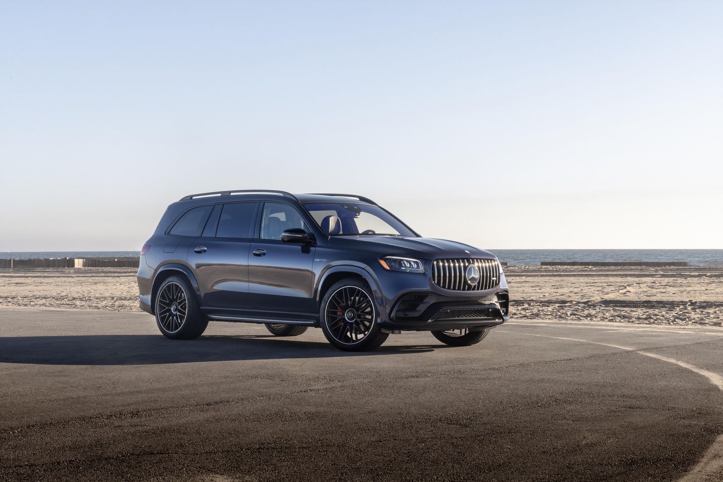 2026 Mercedes-Benz GLS 580 - Front three-quarter view of a dark blue 2026 Mercedes-Benz GLS 580 parked on a beach - Mercedes-Benz Brampton - New car dealership in Brampton, Ontario