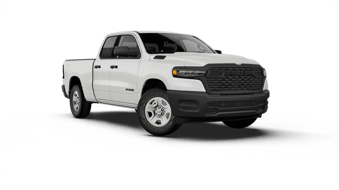 White Ram 1500 Tradesman with a black grille and steel wheels, shown from the front three-quarter angle.