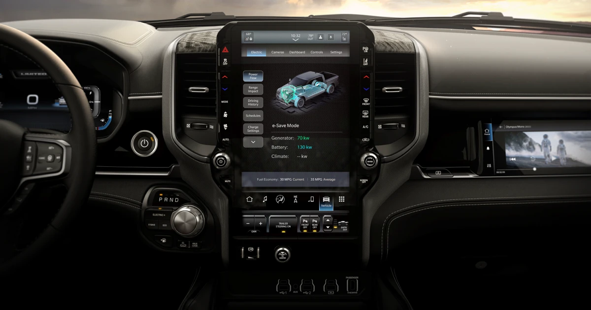 Close-up of the Ram 1500 REV central touchscreen displaying energy information and E-Save mode.