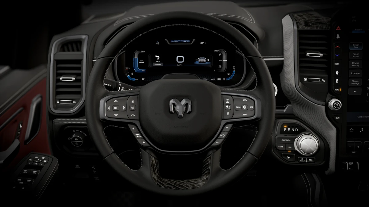 Ram 1500 REV multifunction steering wheel and digital instrument cluster with driving information.