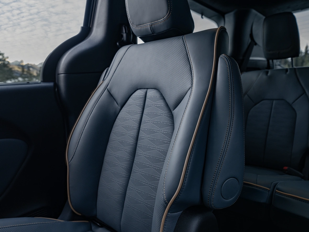 Close-up of a Chrysler Pacifica leather seat with contrast stitching in the Limited AWD interior section.