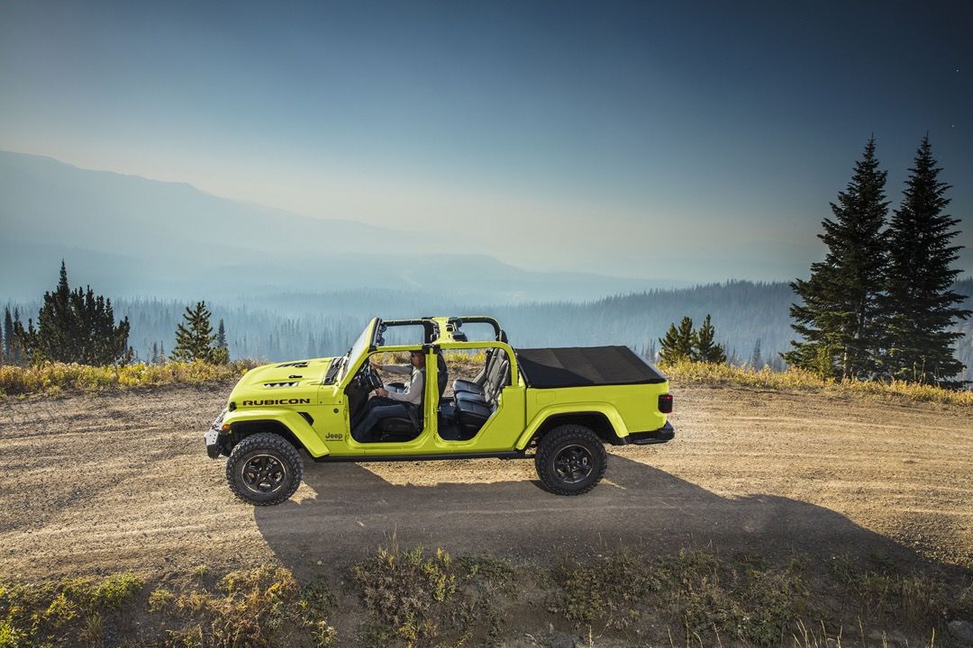 side view of a 2023 Jeep Gladiator on a mountain trail
